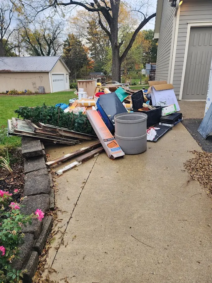 Dumpster being loaded with debris for Commercial Dumpster Rental in South Windsor